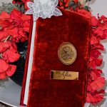 red customised Quran